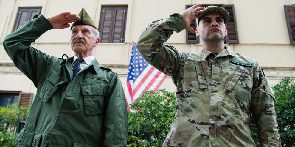 Veteran and Military Son Salute in Front of Base on Memorial Day