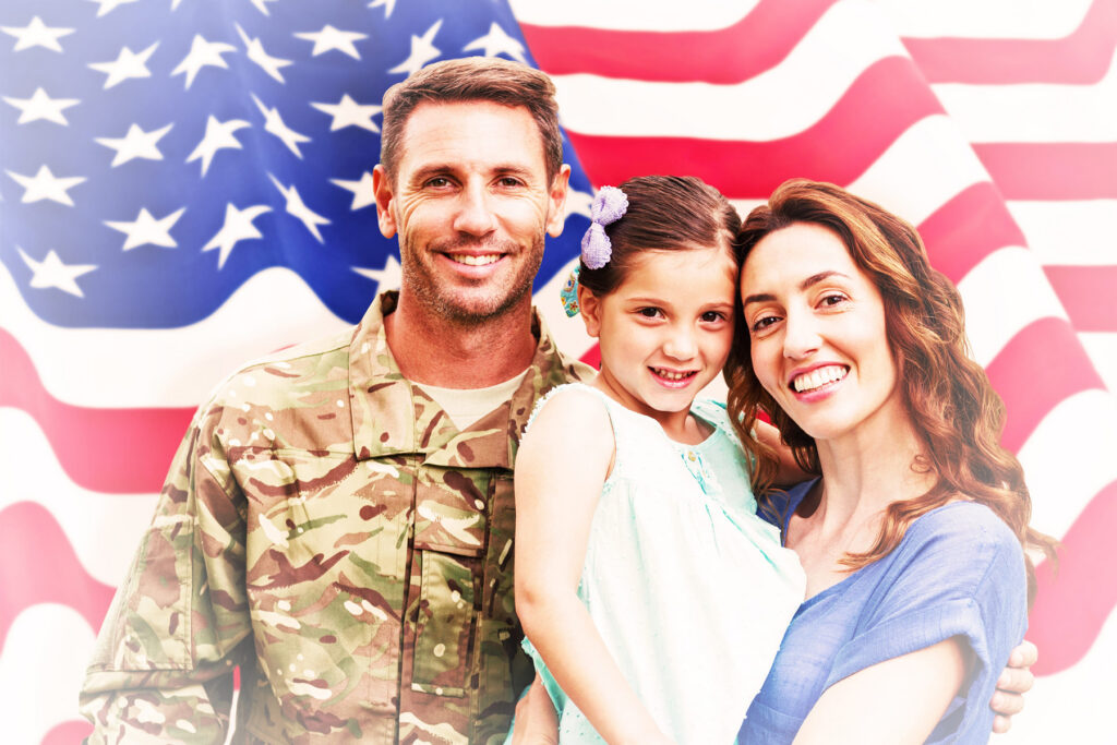 Soldier reunited with family against rippled us flag - Landmark Chiropractic